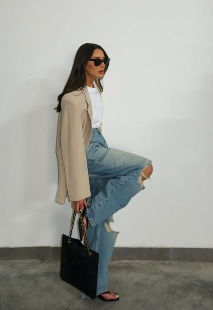 <strong>WIDE-LEG JEANS</strong> –Featuring stylish knee rips for an effortlessly cool look. Grab yours before they’re gone.